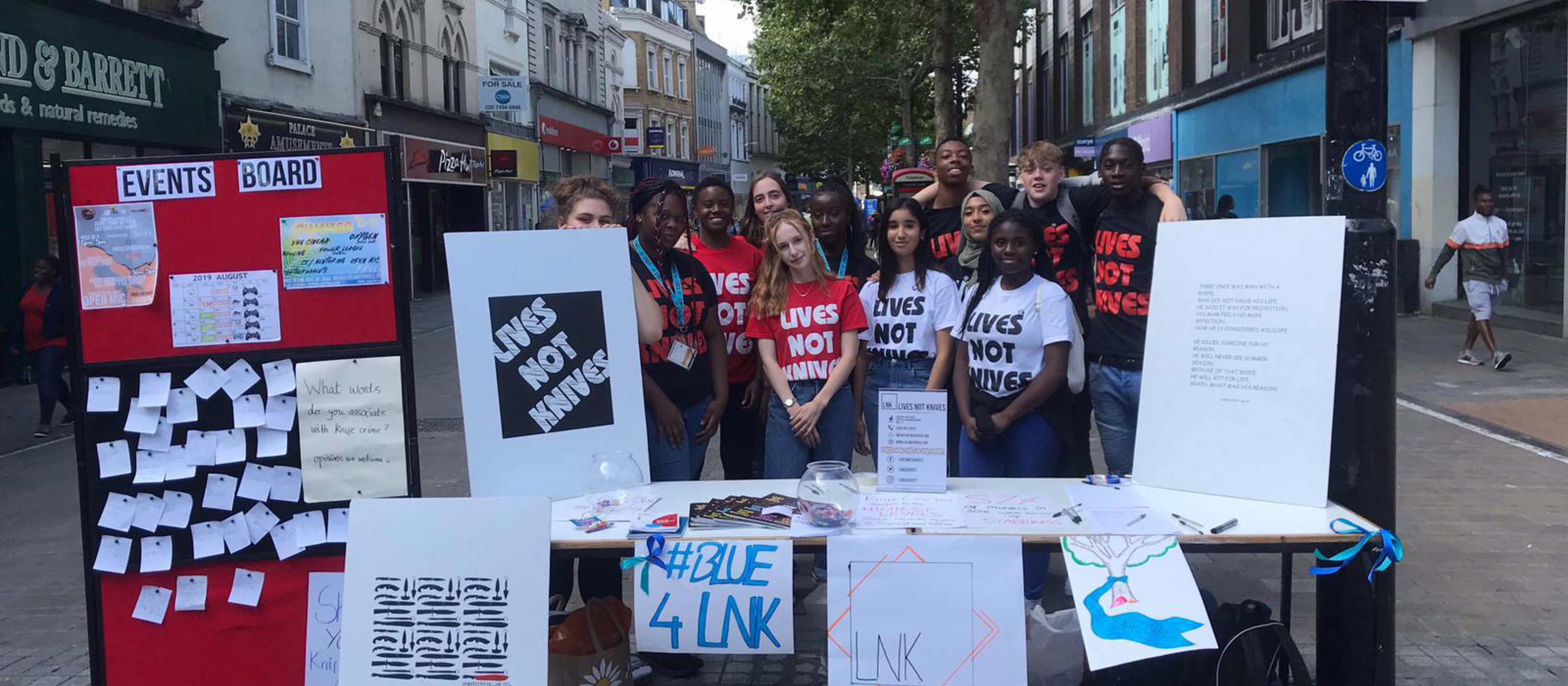 Young people at Lives Not Knives awareness stand on highstreet